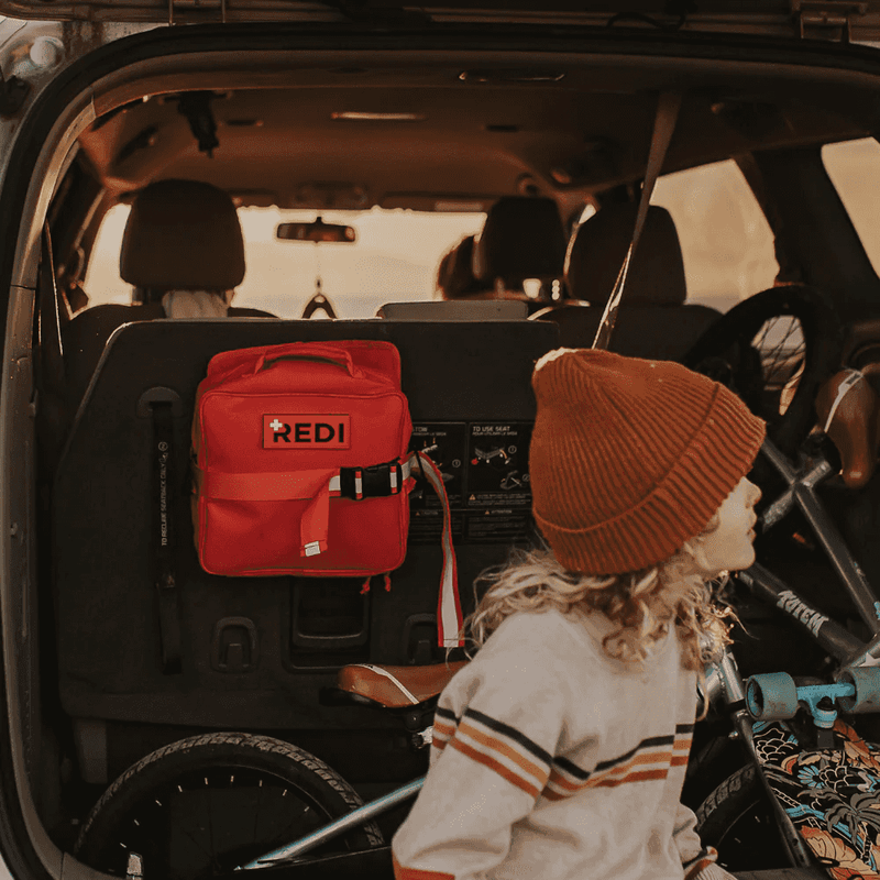 Roadie Auto First Aid Kit with kid back of vehicle