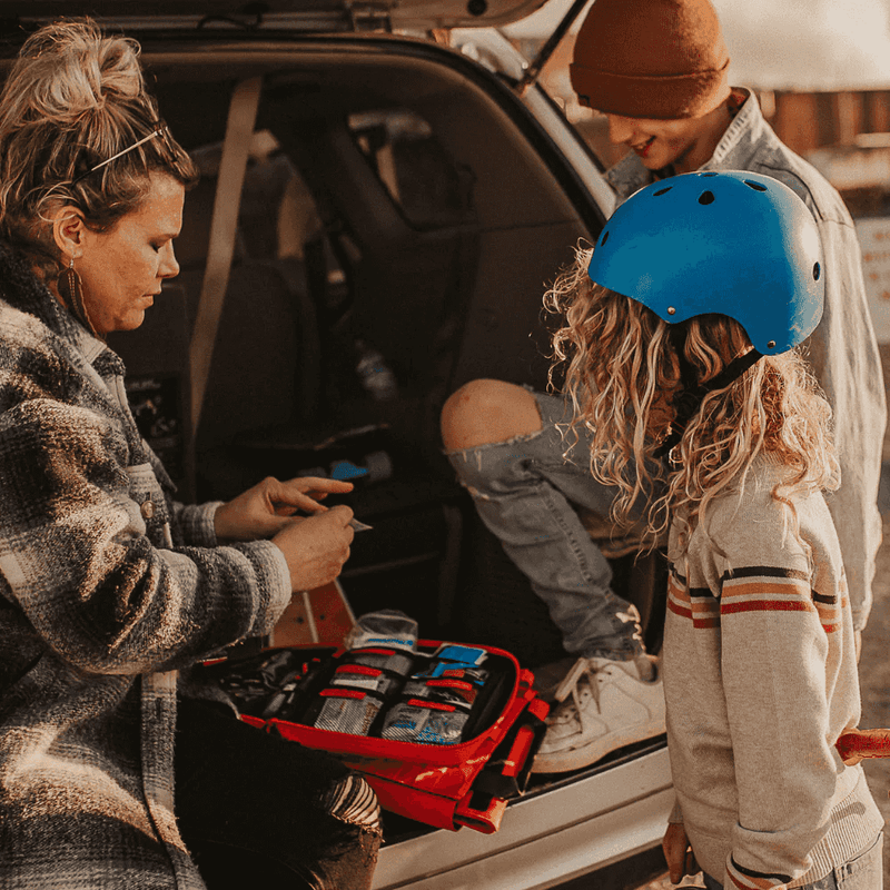 Roadie Auto First Aid Kit Being Used by Mom for Kids