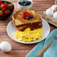 Powdered eggs prepared as scrambled eggs with French toast and berries