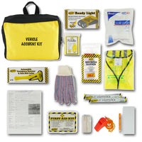 A vehicle accident kit laid out on a white background, including a yellow and black bag labeled 'VEHICLE ACCIDENT KIT,' a ready light box, a windshield washer fluid pouch, a warning triangle, gloves, a first aid kit, light sticks, and other safety accessories.
