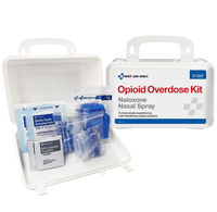 Opioid overdose kit with Naloxone nasal spray and other supplies on a white background