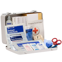 First aid kit with various supplies on a white background